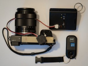 Sony NEX-7 with attached trigger, controller box, radio transmitter