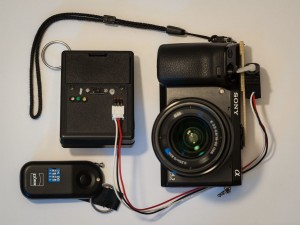 Sony NEX-7 with attached trigger, controller box, radio transmitter